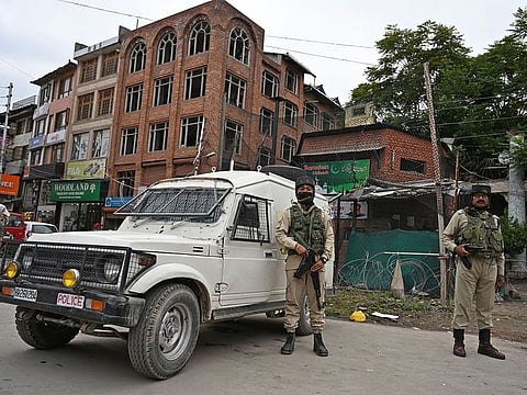 Indian paramilitary troopers stand guard in Srinagar on Wednesday, following an attack to a Central Reserve Police Force (CRPF) patrol were at least five Central CRPF personnel were killed during the suspected militant attack in south Kashmir's Anantnag district along the KP road.   