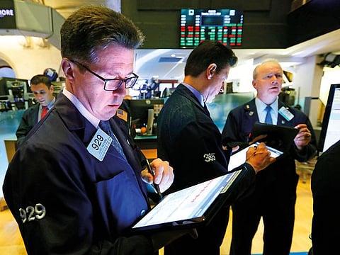 Traders at the New York Stock Exchange. At 11:18am ET yesterday, the Dow Jones Industrial Average was down 0.18 per cent at 26,000.36, while the S&P 500 fell 0.23 per cent to 2,879.22.