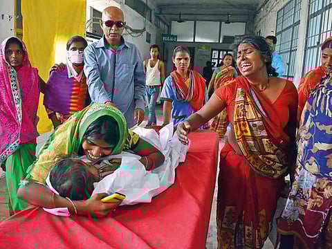 Muzaffarpur: Children showing the symptoms of  Acute Encephalitis Syndrome (AES) being treated at a hospital in Muzaffarpur, Tuesday, June 11, 2019.  At least a dozen of children in the city have died due to the disease while many others are being treated in several hospitals. (PTI Photo)    (PTI6_11_2019_000098B)