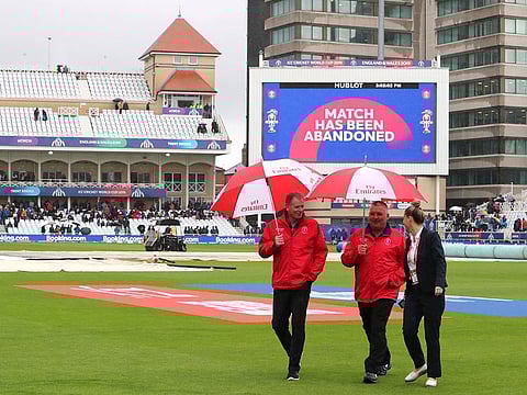 File photo: Umpires walk off the field after calling off the match between India and New Zealand at Trent Bridge in Nottingham. 