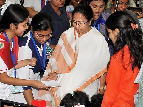 Students seek blessings from West Bengal Chief Minister Mamata Banerjee during a felicitation ceremony of meritorious students in Delhi and West Bengal Board examinations in 2019, in Kolkata, Wednesday, June 12, 2019.