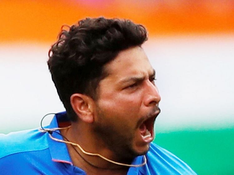 India's Kuldeep Yadav celebrates the wicket of Pakistan's Babar Azam
