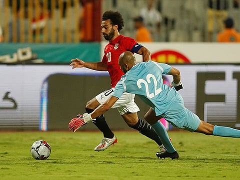 Egypt's Mohammad Salah in action with Guinea's Aly Keita.