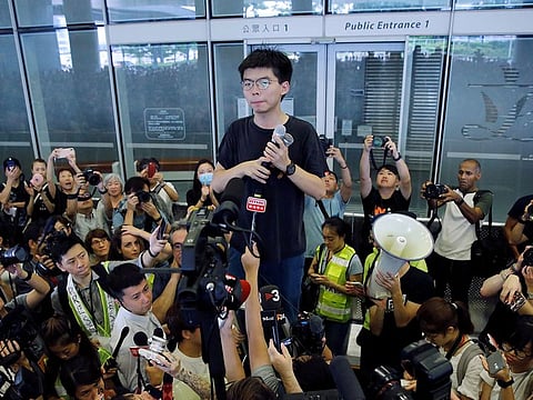 Pro-democracy activist Joshua Wong addresses the crowds outside the Legislative Council during a demonstration demanding Hong Kong's leaders to step down and withdraw the extradition bill, in Hong Kong, China.