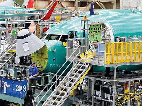 A Boeing 737 MAX 8 is shown on the assembly line at Boeing’s 737 assembly facility in Renton, Washington. A government report says Boeing did not give regulators documents about changes it made in a key system blamed in two deadly crashes of its 737 Max jet. 