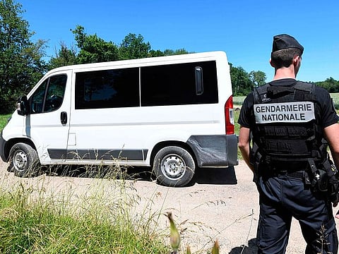 French gendarmerie convoy leaves the wood near Esmoulins, eastern France, during the re-enactment of the murder of Alexia Daval on June 17, 2019.