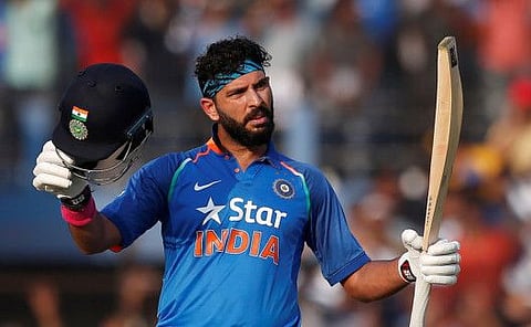 FILE PHOTO: Cricket - India v England - Second One Day International - Barabati Stadium, Cuttack, India - 19/01/17. India's Yuvraj Singh celebrates after scoring a century.  REUTERS/Adnan Abidi/File Photo