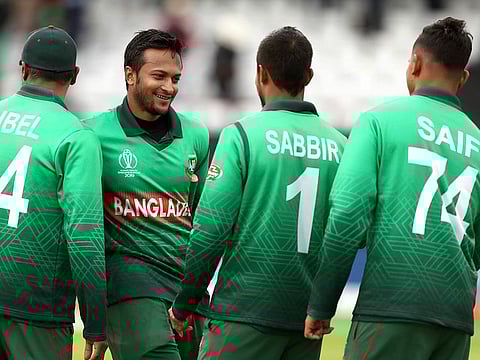 Bangladesh's Shakib Al Hasan, second left, and teammates celebrate winning the match against West Indies at The Taunton County Ground. 
