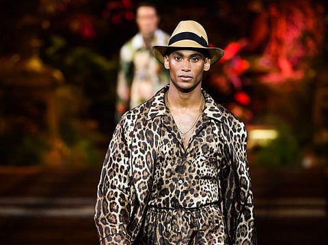 A model presents a creation for fashion house Dolce & Gabbana during the presentation of its men's spring/summer 2020 fashion collection in Milan on June 15, 2019.  / AFP / Marco Bertorello