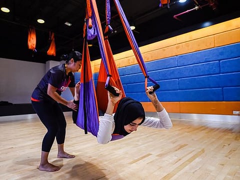 Learn how to do aerial yoga