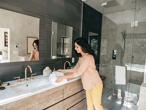Women organizing bathroom