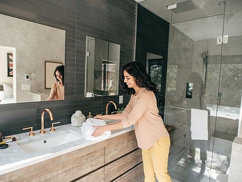 Women organizing bathroom