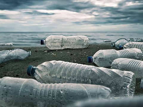 Plastic water bottles pollution in ocean (Environment concept)