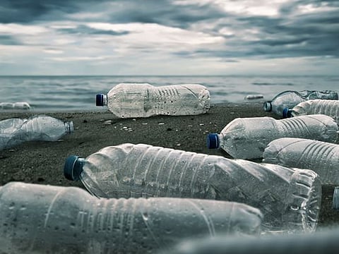 Plastic water bottles pollution in ocean (Environment concept)