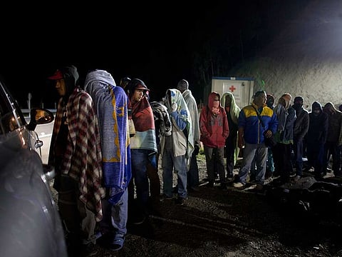 File photo: Venezuelan migrants line up for free bread and coffee, donated by a Colombian family from their car, at a gas station in Pamplona, Colombia. A record 71 million people have been displaced worldwide from war, persecution and other violence, the U.N. refugee agency said Wednesday, June 18, 2019.