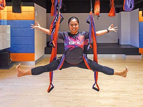Group of young afro american and caucasian sporty people practicing yoga lesson lying in Dead Body pose, Savasana exercise, working out, resting after practice, indoor close up, studio