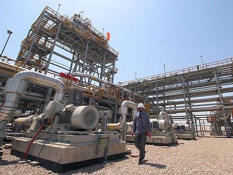A staff of the West Qurna-1 oilfield, which is operated by ExxonMobil, is seen at the West Qurna-1 oilfield, Iraq. 