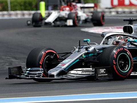Mercedes driver Lewis Hamilton of Britain, front, steers his car during the third practice at the Paul Ricard racetrack in Le Castellet, southern France.
