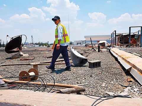 File picture: A picture taken during a guided tour with the Saudi military on June 13, 2019 shows a worker fixing inspecting the damage at Abha airport in the popular mountain resort of the same name in the southwest of Saudi Arabia, one day after a Yemeni rebel missile attack on the civil airport, wounding 26 civilians. 