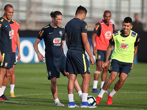Brazil's Roberto Firmino, right, and teammates attend a training session for the Copa America in Porto Alegre. 