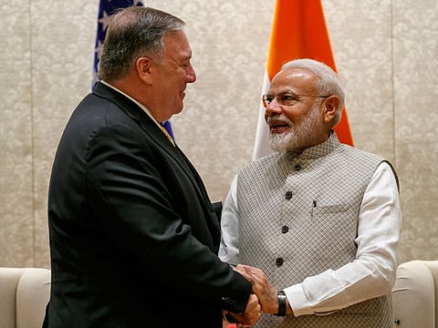 US Secretary of State Mike Pompeo, left, shakes hands with Indian Prime Minister Narendra Modi, during their meeting at the Prime Minister's Residence, Wednesday, June 26, 2019, in New Delhi, India. 