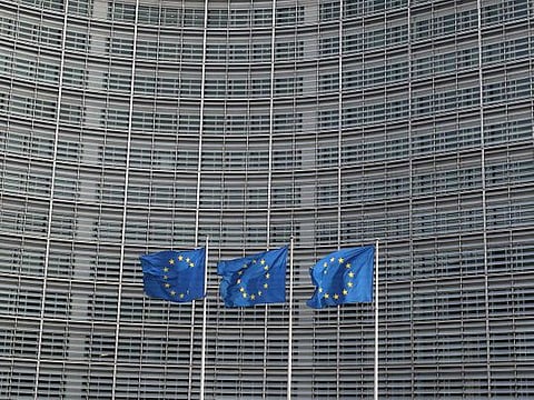 European Union flags fly outside the European Commission headquarters in Brussels, Belgium.