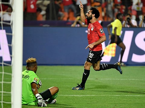 Egypt's forward Mohammad Salah celebrates after scoring a goal during the 2019 Africa Cup of Nations (CAN) football match against DR Congo at the Cairo International Stadium on June 26, 2019. 