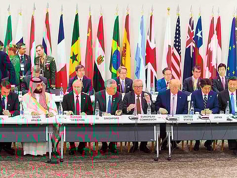 From left: Brazil’s President Jair Bolsonaro, Saudi Arabia’s Crown Prince Mohammad Bin Salman, Russia’s President Vladimir Putin, Singapore’s Prime Minister Lee Hsien Loong, President of the European Commission Jean-Claude Juncker, US President Donald Trump, Japan’s Prime Minister Shinzo Abe and China’s President Xi Jinping at the summit 