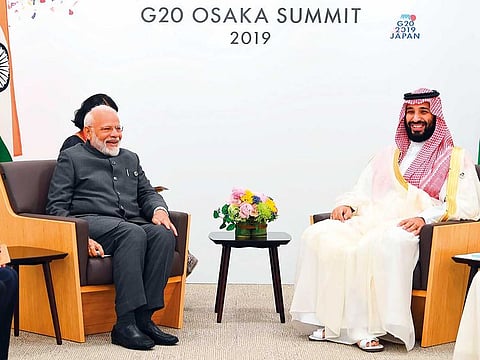 Indian Prime Minister Narendra Modi (L) meeting with Saudi Arabia's Crown Prince Mohammed bin Salman during the G20 Summit in Osaka. 