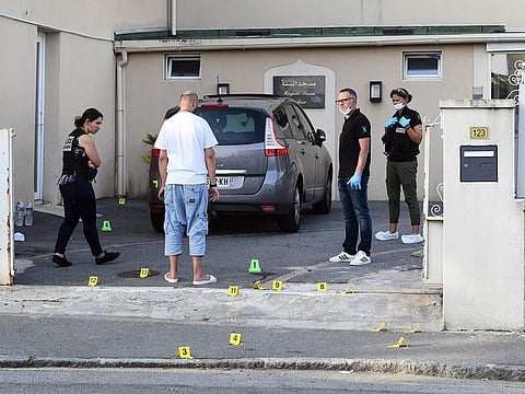 Police officers work at the site of a shooting incident that left two people including an iman injured on June 27, 2019, at the Sunna mosque in Brest's Pontanezen neigbourhood, western France.
