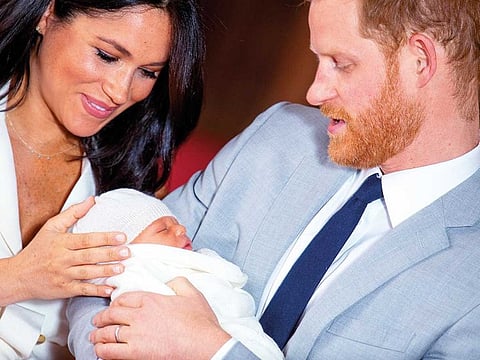Britain's Prince Harry and Meghan, Duchess of Sussex hold their baby son during a photocall in St George's Hall at Windsor Castle, in Berkshire, Britain