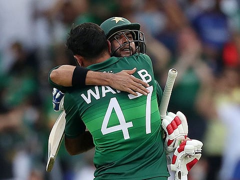 Pakistan's Imad Wasim and Wahab Riaz celebrate winning the match 