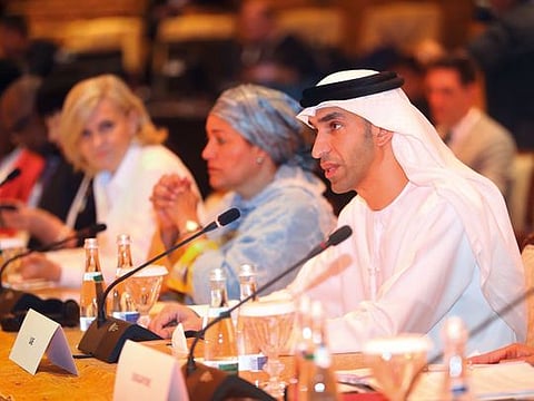 A child cools off under water jets in a fountain during a heatwave in Montpellier,  southern France.