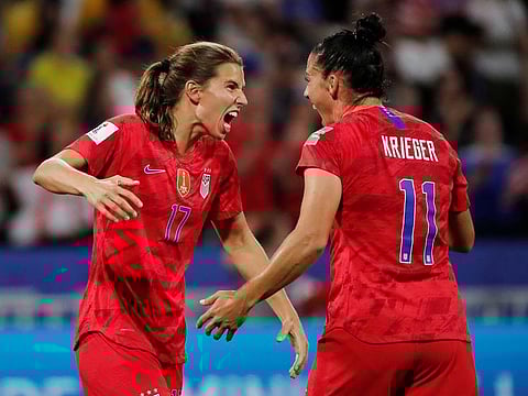 Tobin Heath and Ali Krieger of the USA celebrate at the end of the match.