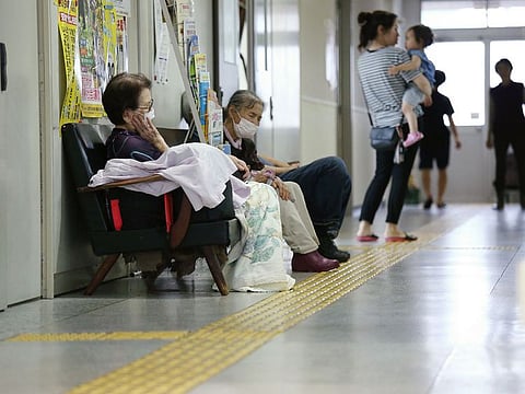Residents take shelter in an evacuation centre in Aira, Kagoshima prefecture on the southern Kyushu island on July 3, 2019. Japanese authorities have issued evacuation orders for more than one million people as heavy rain hits southern parts of the country, a year after deadly floods that killed over 200 people