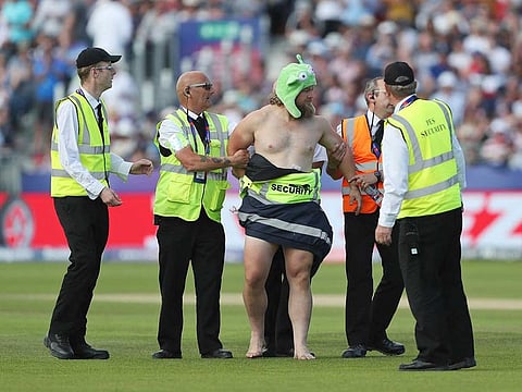 A streaker runs into the field during the World Cup match between New Zealand and England in Chester-le-Street, on July 3, 2019. 