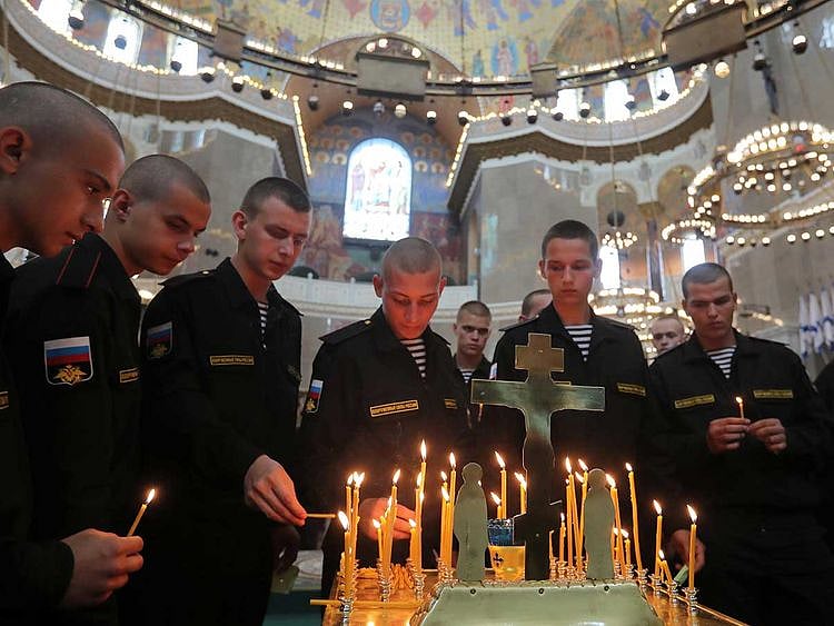 Russian servicemen attend a memorial service