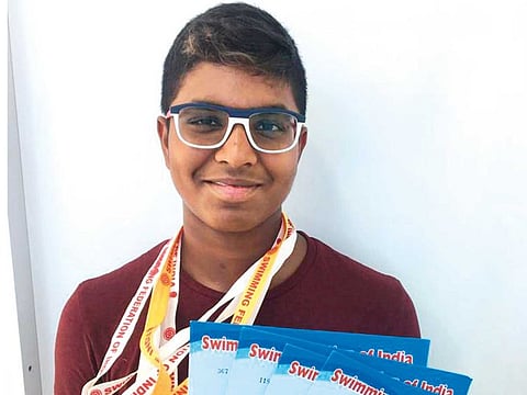 Vissesh Sharma shows off his medals and certificates following his victories in Rajkot, Gujarat, last week.