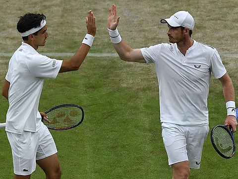 Britain's Andy Murray (R) and France's Pierre-Hugues Herbert celebrate.