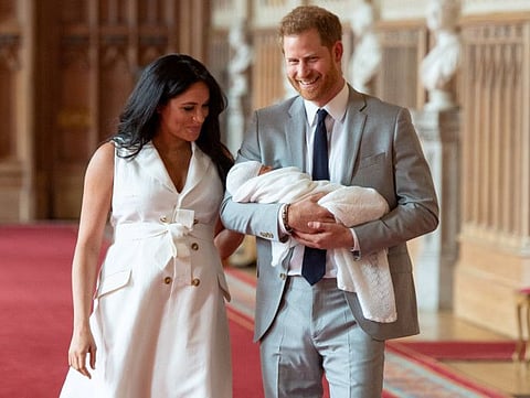 FILE PHOTO: Britain's Prince Harry and Meghan, Duchess of Sussex are seen with their baby son during a photocall in St George's Hall at Windsor Castle, in Berkshire, Britain May 8, 2019. Dominic Lipinski/Pool via REUTERS/File Photo