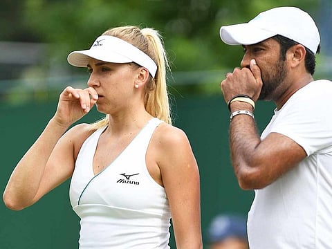 Pakistan's Aisam-ul-Haq Qureshi (R) and Ukraine's Nadiia Kichenok talk as they play Mexico's Santiago Gonzalez and China's Han Xinyun during their mixed doubles first round match on the sixth day of the 2019 Wimbledon Championships at The All England Lawn Tennis Club in Wimbledon, southwest London, on July 6, 2019.  