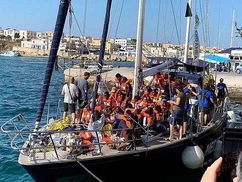 The Italian NGO Mediterranea Saving Humans' Alex migrant rescue ship carrying 46 migrants rescued off Libya coasts, docks in the port of Lampedusa, Sicily island, Italy, Saturday,  July 6, 2019.