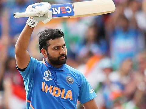 India's Rohit Sharma celebrates after scoring a century during the World Cup match against Sri Lanka at Headingley in Leeds, on July 6, 2019. 