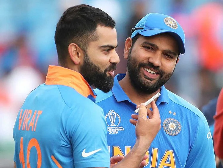 India's captain Virat Kohli, left, interviews teammate Rohit Sharma