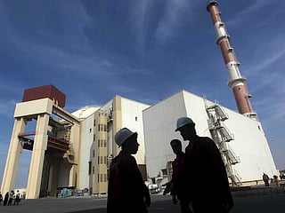Iranian workers in front of Bushehr nuclear power plant
