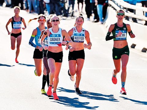 Elite women runners in the 2018 TCS New York City Marathon hit the 13.1 mile marker on the Pulaski Bridge in Brooklyn.