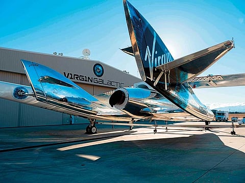 File photo: SpaceShipTwo mates to the mothership, WhiteKnightTwo, at Mojave Space Port on February 19, 2019, in Mojave, California.  