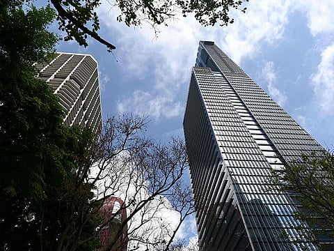 A view of Guoco Tower (R), where a luxury penthouse at Wallich Residence is located, is seen in Singapore on July 10, 2019. British billionaire inventor James Dyson has splashed out a reported 54 million USD on the biggest, most expensive penthouse in Singapore, a three-floor residence with a rooftop terrace, private pool and jacuzzi