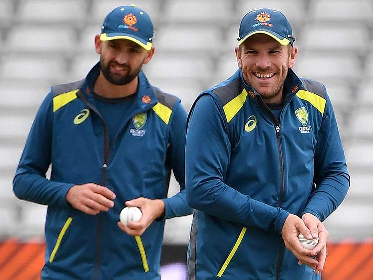 Australia's Nathan Lyon (L) and Aaron Finch