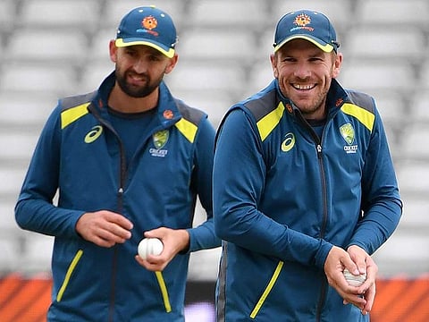 Australia's Nathan Lyon (L) and Aaron Finch attend a training session at Edgbaston in Birmingham, ahead of their World Cup semi-final match against England.  